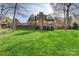 Manicured backyard and deck area highlight this home's exterior at 5108 Tedorill Ln, Charlotte, NC 28226