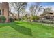Grassy backyard featuring a rock garden and landscaping at 5108 Tedorill Ln, Charlotte, NC 28226