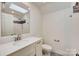 Modern bathroom with a vanity, a skylight, and a tiled walk-in shower for a spa-like experience at 5108 Tedorill Ln, Charlotte, NC 28226