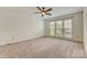 Bright bedroom features large windows and neutral carpet at 5108 Tedorill Ln, Charlotte, NC 28226
