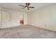 Spacious bedroom with a ceiling fan and ensuite bathroom for added convenience at 5108 Tedorill Ln, Charlotte, NC 28226