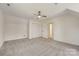 Bedroom with closet, ceiling fan, and access to hallway, providing comfortable living space at 5108 Tedorill Ln, Charlotte, NC 28226