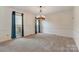 Bright dining room featuring updated chandelier and great natural light at 5108 Tedorill Ln, Charlotte, NC 28226