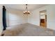 Bright dining room featuring updated chandelier and great natural light at 5108 Tedorill Ln, Charlotte, NC 28226