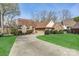 Beautiful home featuring a spacious driveway, attached garage, and well-maintained lawn at 5108 Tedorill Ln, Charlotte, NC 28226