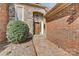 Inviting front entrance with brick pathway, stone archway, and handsome wood door at 5108 Tedorill Ln, Charlotte, NC 28226