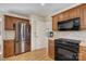 Updated kitchen boasts stainless steel appliances and wood cabinets at 5108 Tedorill Ln, Charlotte, NC 28226