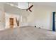 Large living room featuring vaulted ceiling, carpet flooring and staircase at 5108 Tedorill Ln, Charlotte, NC 28226