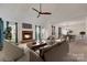 Bright living room featuring a fireplace, vaulted ceiling, and neutral carpet at 5108 Tedorill Ln, Charlotte, NC 28226