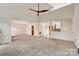 Spacious living room with vaulted ceilings, neutral carpet and access to other rooms at 5108 Tedorill Ln, Charlotte, NC 28226