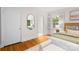 Bedroom with hardwood floors, closet, a full size mirror and ensuite bathroom at 5162 Lincrest Pl, Charlotte, NC 28211