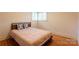 Bedroom with a neatly made bed and a black headboard, accented by patterned pillows at 5162 Lincrest Pl, Charlotte, NC 28211