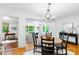 Bright dining room has hardwood floors and is conveniently located near the living room and kitchen at 5162 Lincrest Pl, Charlotte, NC 28211