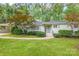Charming one-story home featuring a well-maintained lawn, stylish shutters, and mature landscaping at 5162 Lincrest Pl, Charlotte, NC 28211