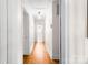 Hallway with hardwood floors connecting bedrooms and bathrooms at 5162 Lincrest Pl, Charlotte, NC 28211