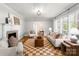 Bright living room with hardwood floors, a cozy fireplace, and plenty of natural light at 5162 Lincrest Pl, Charlotte, NC 28211