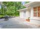 Back patio, perfect for outdoor entertaining, with stone accents and comfortable seating area at 5162 Lincrest Pl, Charlotte, NC 28211