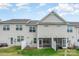Exterior rear view of the home with a fenced in yard and covered patio area at 6011 Chelsea Oaks Rdg, Tega Cay, SC 29708