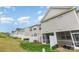 Exterior view of a row of homes with fenced backyards and screened-in patios at 6011 Chelsea Oaks Rdg, Tega Cay, SC 29708
