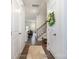 Inviting entryway with hardwood flooring, white trim and a view of the open floor plan at 6011 Chelsea Oaks Rdg, Tega Cay, SC 29708