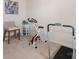 Exercise room featuring a treadmill, exercise bike and woven chair with side table at 6011 Chelsea Oaks Rdg, Tega Cay, SC 29708