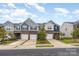 Street view of well-maintained townhomes with attractive brick and siding exteriors at 6011 Chelsea Oaks Rdg, Tega Cay, SC 29708