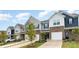 Lovely townhome with brick accents, a one car garage, and professionally landscaped front yard at 6011 Chelsea Oaks Rdg, Tega Cay, SC 29708
