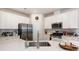 Bright kitchen featuring stainless steel appliances, white cabinets, and subway tile backsplash at 6011 Chelsea Oaks Rdg, Tega Cay, SC 29708