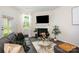 Cozy living room with a black fireplace, a modern glass table, and a gray sofa at 6011 Chelsea Oaks Rdg, Tega Cay, SC 29708