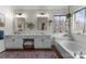 Bright bathroom features double sinks, quartz countertops and a separate soaking tub under a garden window at 611 Meadow Lake Dr, Matthews, NC 28105