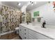Bathroom features double sink vanity with black fixtures, modern lighting and tiled shower/tub at 611 Meadow Lake Dr, Matthews, NC 28105