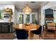 Dining area with wooden table, wicker light fixture and hardwood floors at 611 Meadow Lake Dr, Matthews, NC 28105