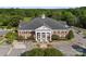 Expansive exterior of a grand public library, showcasing classic architecture with prominent columns and an elegant clock tower at 611 Meadow Lake Dr, Matthews, NC 28105