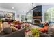 Spacious living room with a fireplace, comfortable seating, and an open layout to the kitchen at 611 Meadow Lake Dr, Matthews, NC 28105