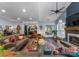 Open-concept living room featuring a fireplace, cathedral ceiling and open view of kitchen at 611 Meadow Lake Dr, Matthews, NC 28105