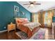 Cozy main bedroom with blue walls, natural light, and hardwood floors at 611 Meadow Lake Dr, Matthews, NC 28105
