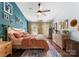 Well-lit main bedroom with hardwood floors, natural light, dresser, and decor at 611 Meadow Lake Dr, Matthews, NC 28105