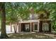 Inviting brick home with a covered front porch and meticulously kept landscaping at 8221 Brookings Dr, Charlotte, NC 28269