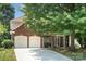 Charming brick home with a two-car garage and a well-maintained front yard at 8221 Brookings Dr, Charlotte, NC 28269