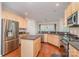 Spacious kitchen boasts stainless steel appliances, granite countertops, and ample cabinet space at 8221 Brookings Dr, Charlotte, NC 28269