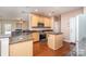 Well-equipped kitchen with granite countertops, stainless steel appliances, and a convenient center island at 8221 Brookings Dr, Charlotte, NC 28269