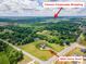 Expansive aerial view of a luxury home on a large, well-manicured lot near shopping area at 8825 Harris Rd, Concord, NC 28027