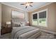 Cozy bedroom with soft colors, bright windows, and a comfortable bed at 8825 Harris Rd, Concord, NC 28027