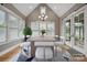 Bright dining room with lots of natural light and a view of the backyard and vaulted ceiling at 8825 Harris Rd, Concord, NC 28027