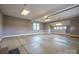 Spacious three car garage with concrete floors, ample lighting, and windows at 8825 Harris Rd, Concord, NC 28027