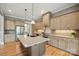Spacious kitchen with a large island, stainless steel appliances, and custom cabinetry at 8825 Harris Rd, Concord, NC 28027