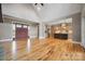 Open-concept living space with hardwood floors, vaulted ceilings, and views of the kitchen at 8825 Harris Rd, Concord, NC 28027