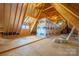 Unfinished attic space with exposed wood beams and insulation at 8825 Harris Rd, Concord, NC 28027