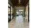 Bright and airy hallway with tile flooring, offering a welcoming entrance to the building's amenities at 934 Prince Garrett Way, Denver, NC 28037
