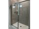 Modern shower with glass enclosure, neutral tiling, and sleek fixtures offers a spa-like experience at 934 Prince Garrett Way, Denver, NC 28037